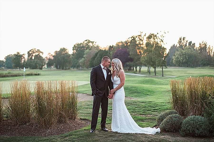 Bride and groom on golf course