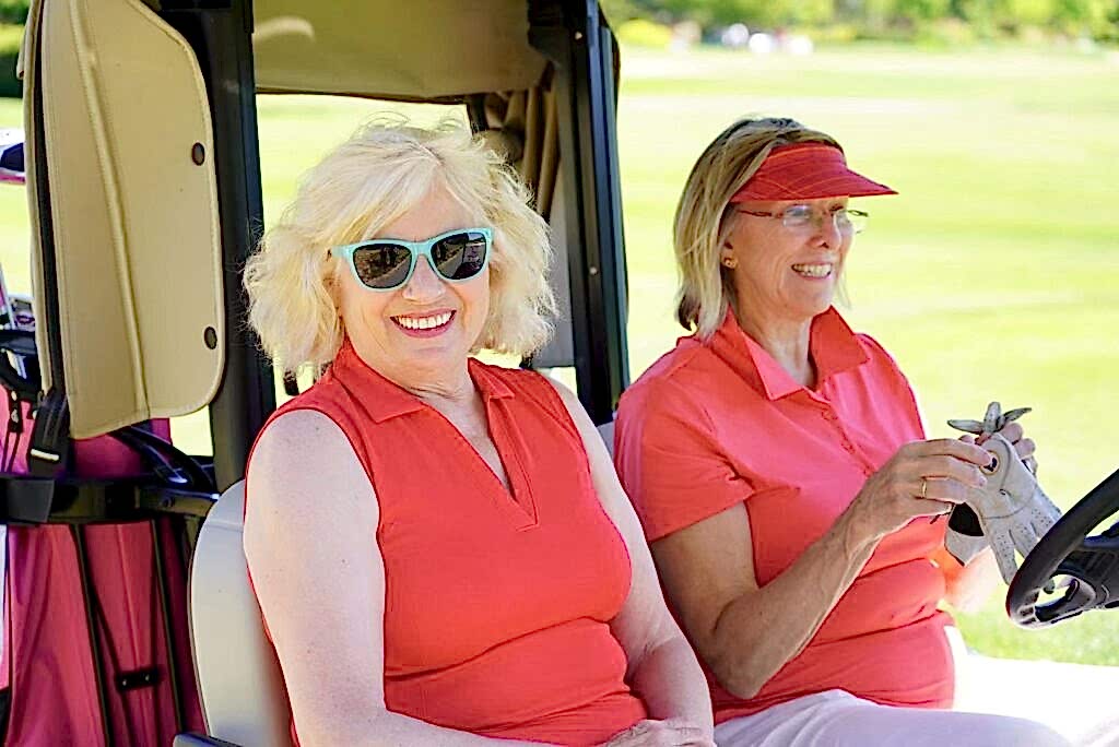 Ladies in a golf cart