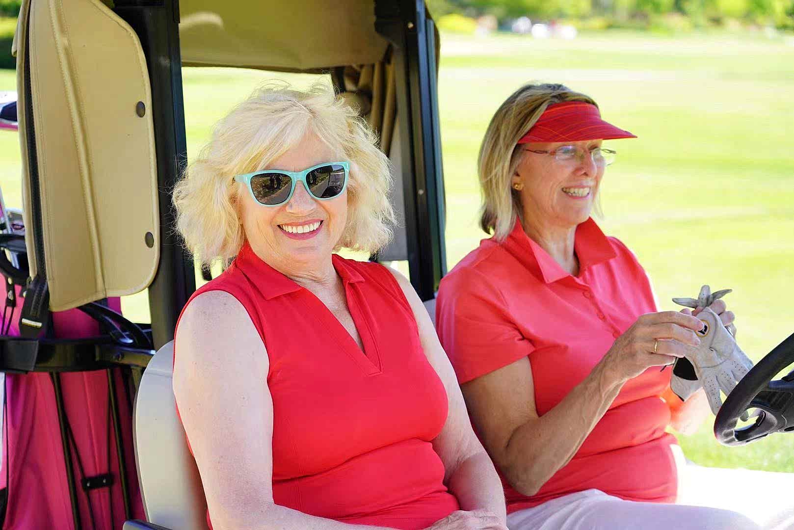 Ladies in a golf cart